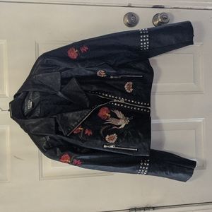 Embroidered faux leather jacket.